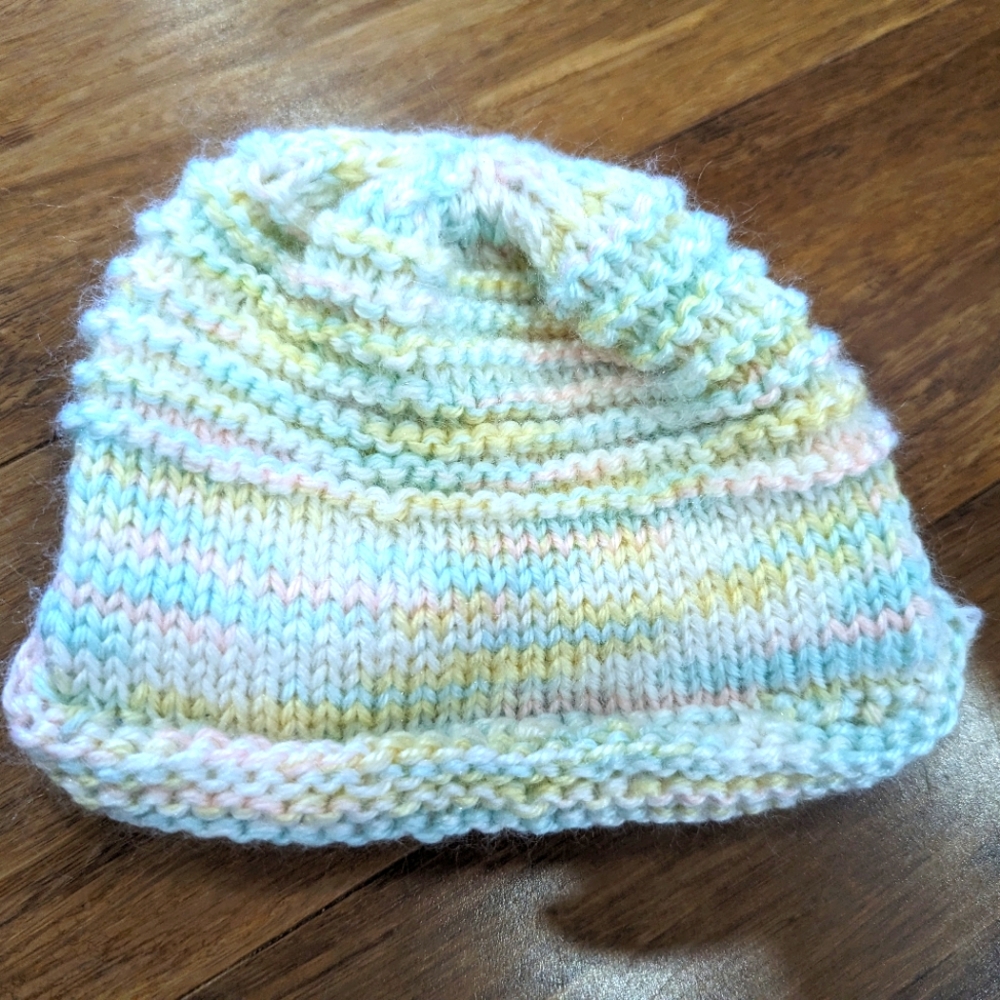 2/$18. Hand knitted hat. Multi coloured. Newborn.